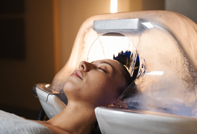 Client enjoying a head spa treatment at HC Studio